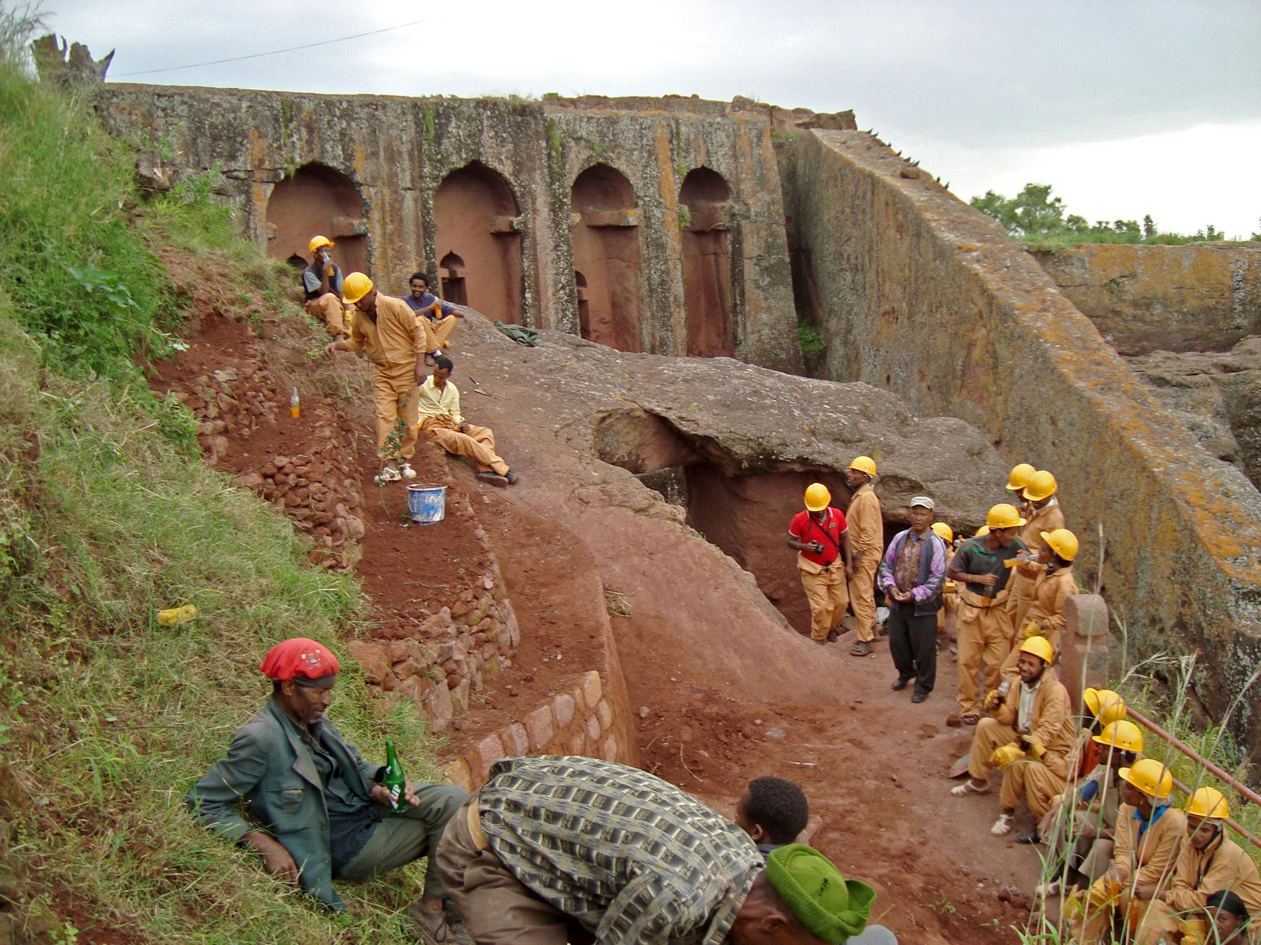 Training course members clear the soil over the entrance of Biete Gabriel Raphael, 2012