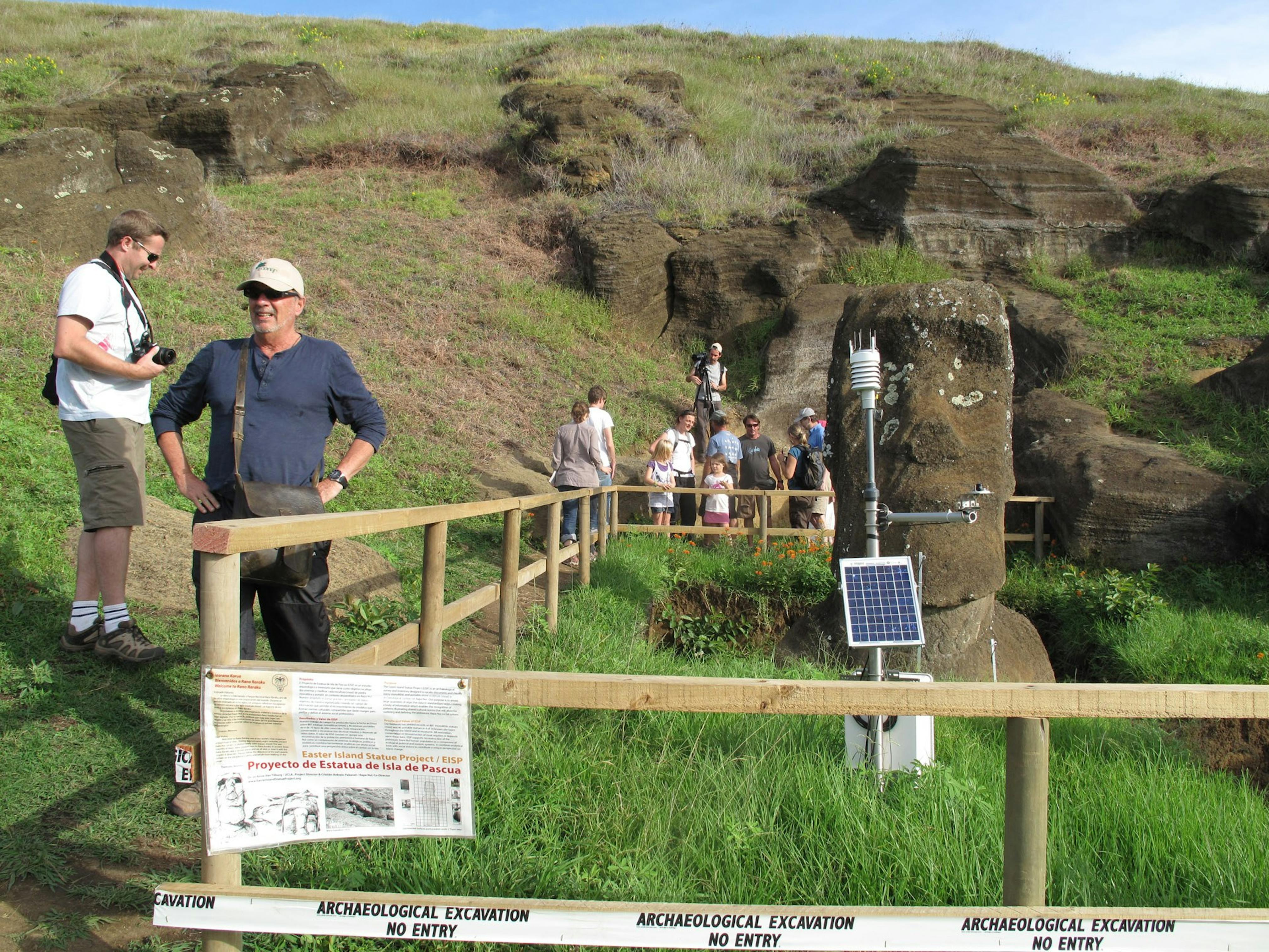 Tourists visit an excavation site on Rano Raraku, 2011