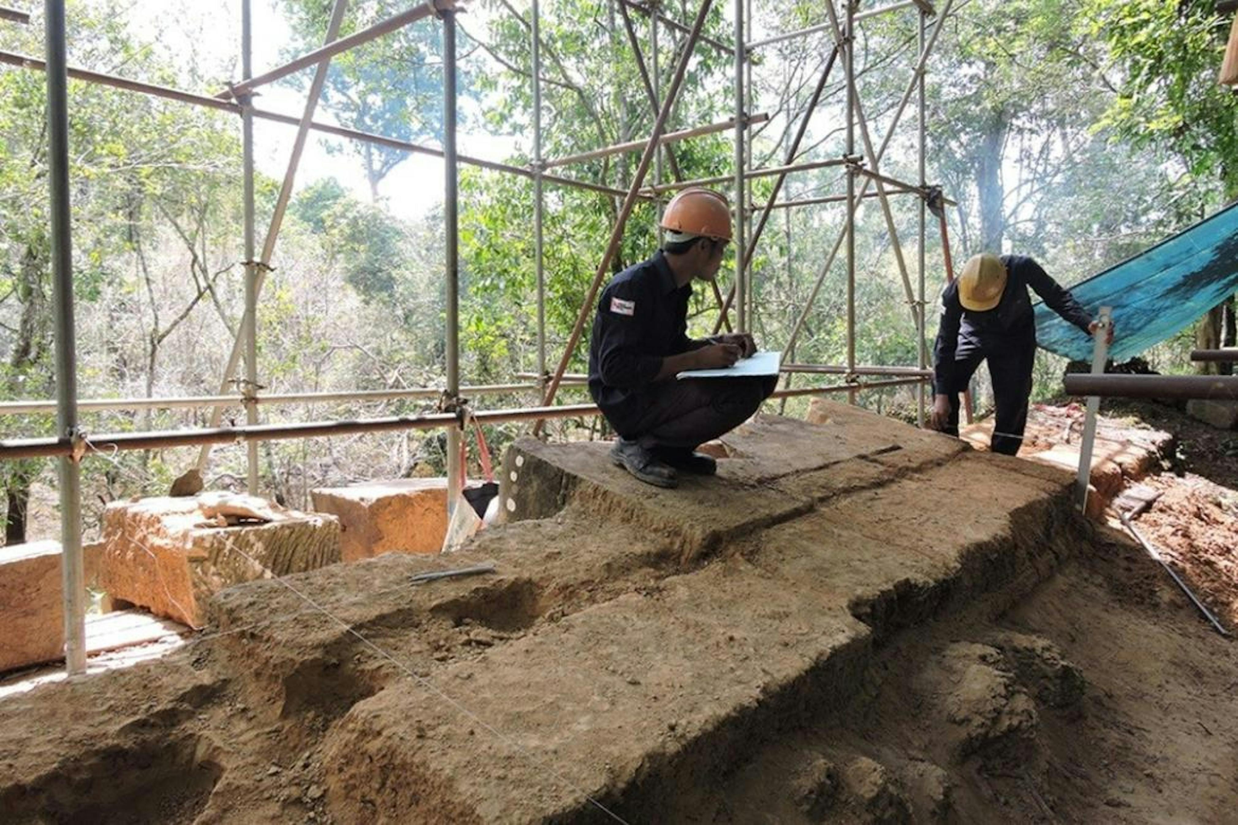 DSCN3678 Workers record and document the structural conditions of the wall in which the Garuda sits