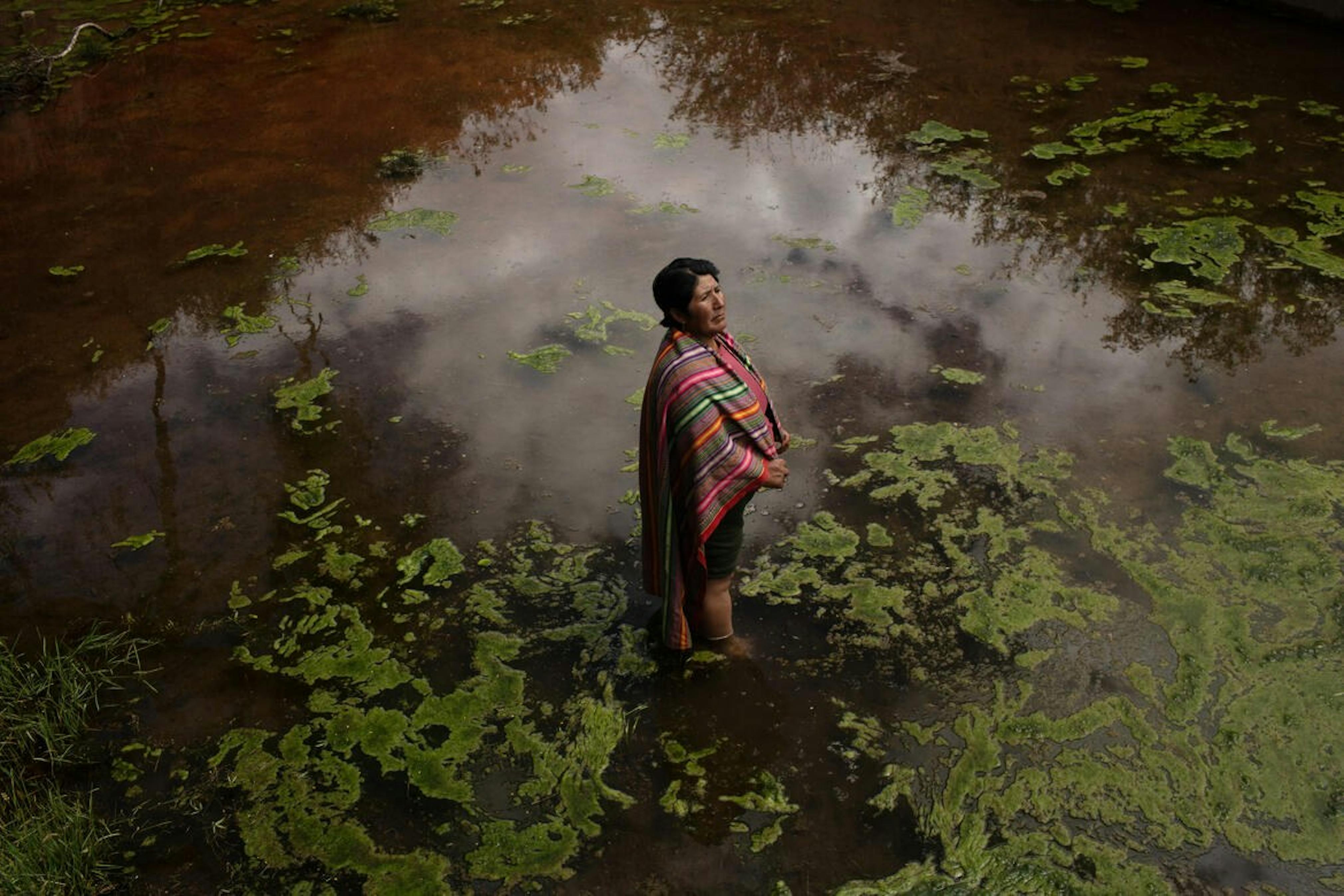 A woman standing in a reservoir.