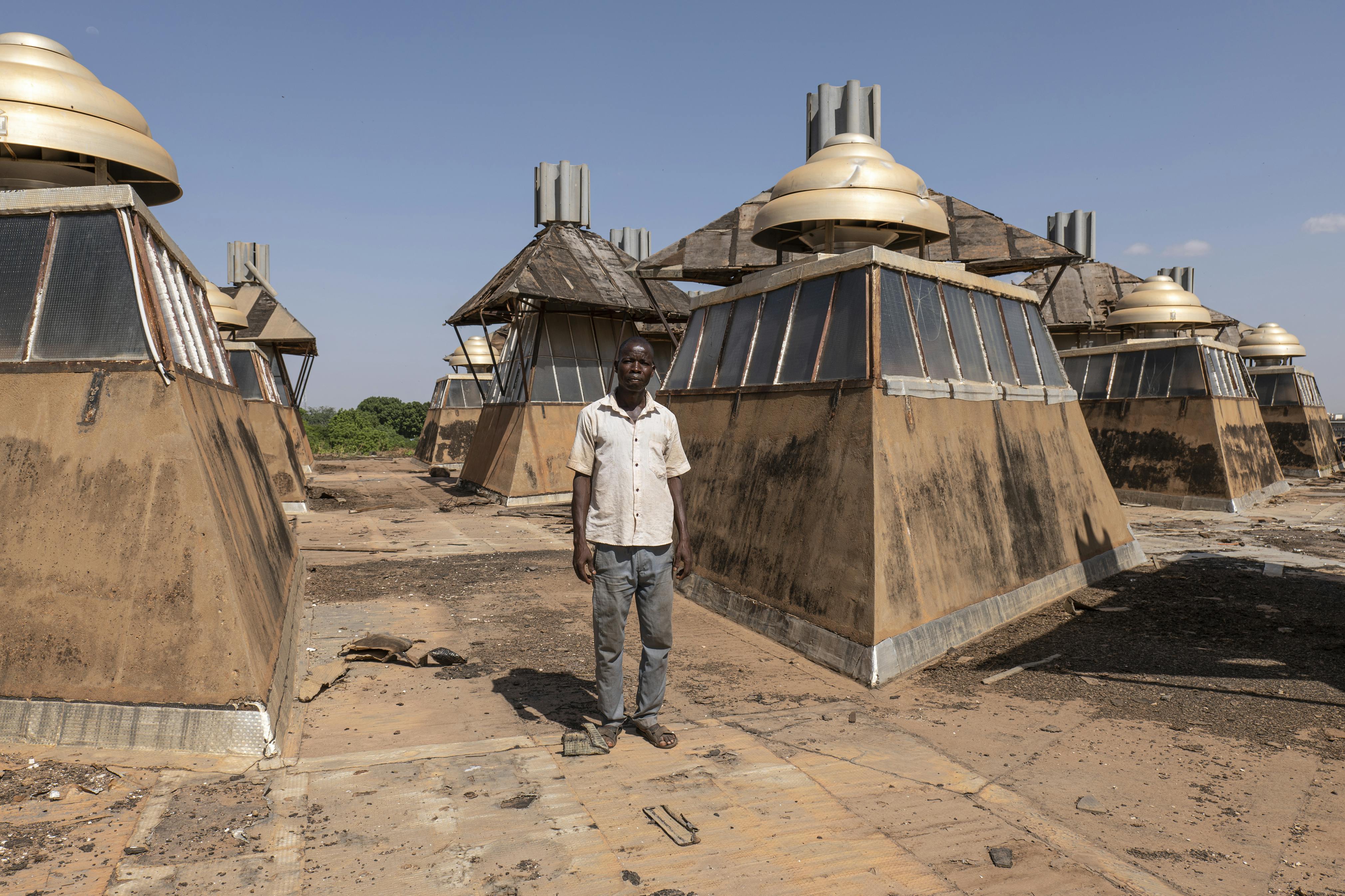 A man standing on top of a structure.