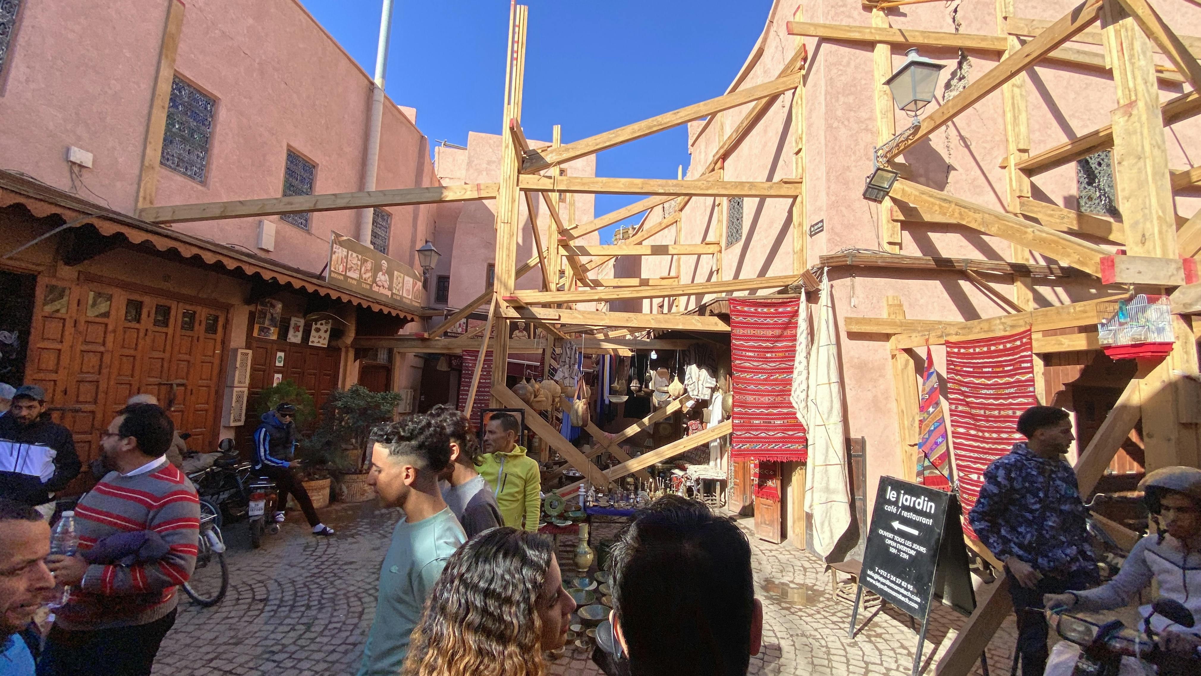 Street in Marrakech with support structures post-earthquake.