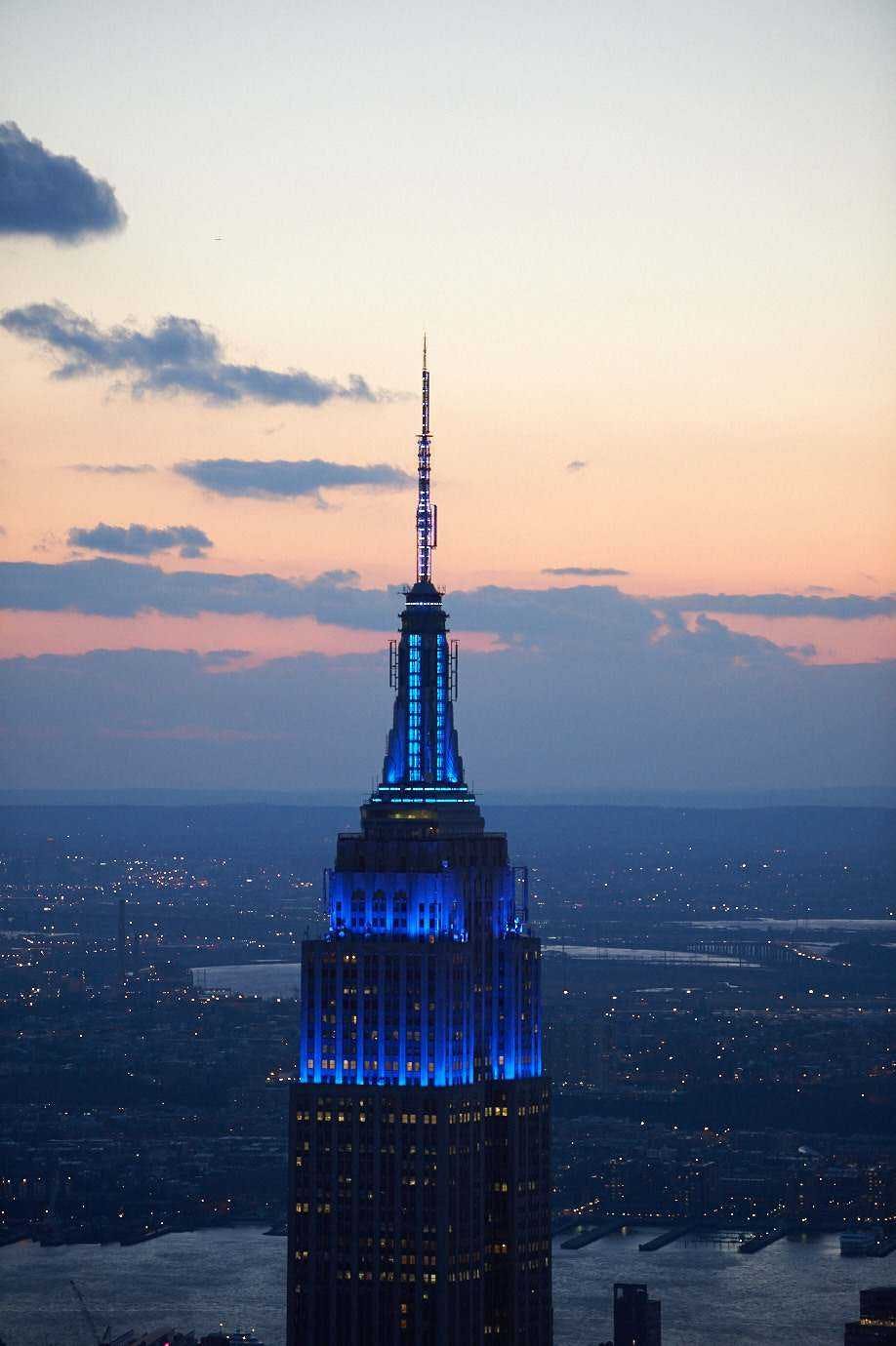 Ea empire state building illuminated in blue in honor of world monuments fu