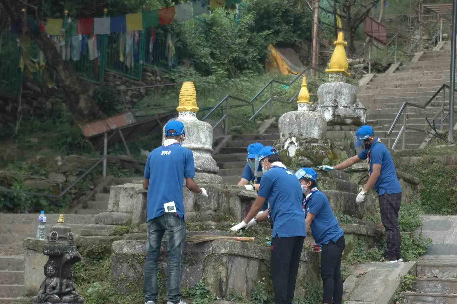 Watch Day volunteers maintaining another set of shrines at Swayambhunath temple, Nepal.